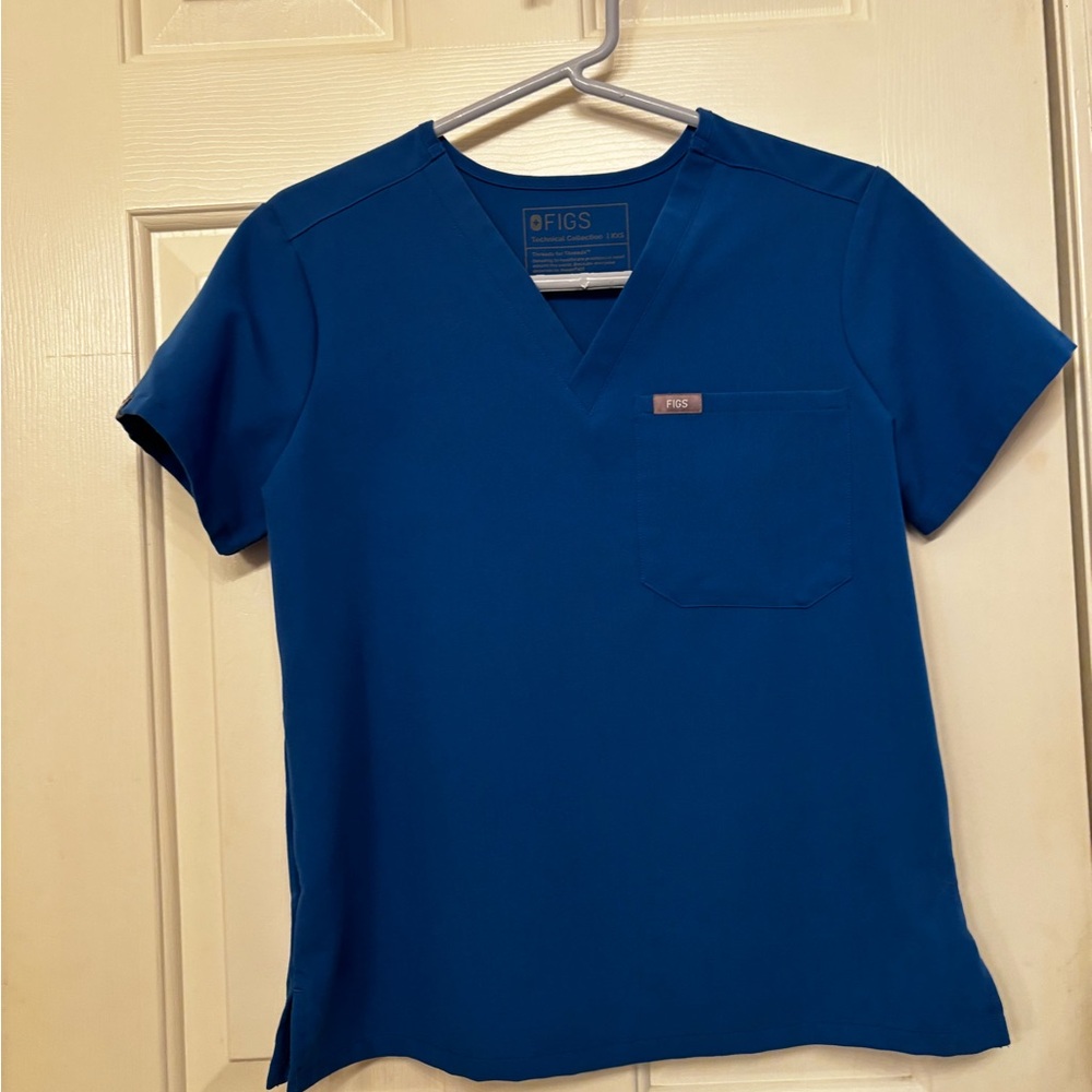 Never worn.

Figs royal blue xxs V-Neck Scrub Top